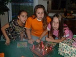 Shelby and best friend Briana help Heather blow out FFOOUURRTTEENN candles.