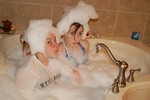 Heather & friend, Kaitlyn - in our jacuzzi tub, “do you like my hat ?”